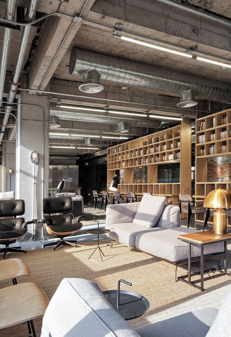 Industrial Office Features Exposed Bricks & Concrete Ceilings